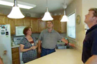 Family in Kitchen with Pendant Lights
