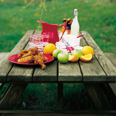 picnic bench with food on it