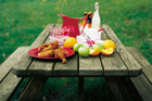 picnic bench with food on it