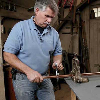 Man creating pot rack 