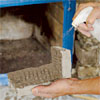 Install the Corner Pieces: Wet the Stone and Wall