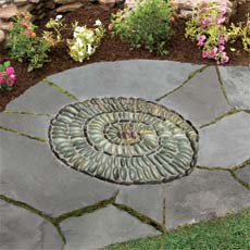 a finished spiral-shaped pebble mosaic