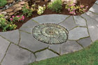 a finished spiral-shaped pebble mosaic