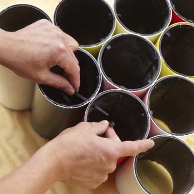 Man attaching the pipes together 