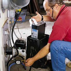 man testing efficiency of furnace
