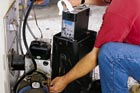 man testing efficiency of furnace