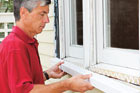 Man installing new windowsill