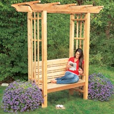 finished arbor bench with woman sitting in it