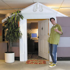 Mark Powers with a margarita outside his cubicle