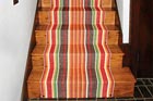 stairs with a colorful stair runner installed