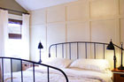 a bedroom with newly installed wood paneling