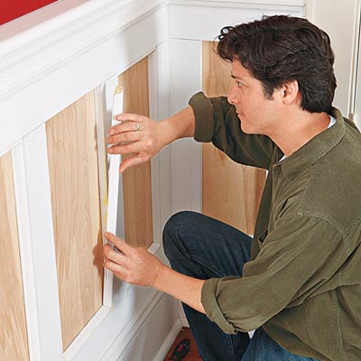 placing the trim for the wainscoting panels