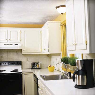the finished kitchen with newly painted cabinets