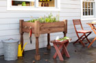 a finished raised herb-garden planter