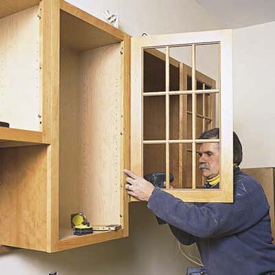 Kitchen Cabinet Doors Replacement on Tom Silva Reattaching Paned Doors To Wood Kitchen Cabinet