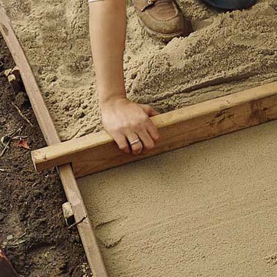 add the sand layer to make a brick path