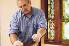 man waxing the wood