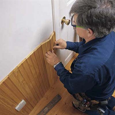 fitting wainscoting against door casing