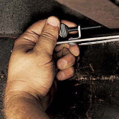 Clamping the door to the lintel.
