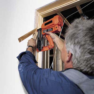 Tom Silva anchoring the jamb of a prehung door 