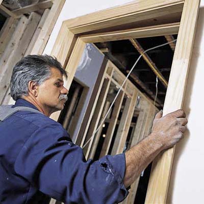 Tom Silva attaching the split jamb of a prehung door