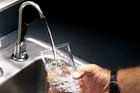 water coming out of a kitchen faucet