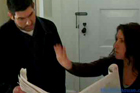 women explains floor plans while man looks on