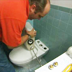 Richard Trethewey shows how to install a dual-flush toilet
