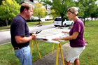 This Old House landscaping contractor Roger Cook and homeowner fixing a sagging, damaged gate