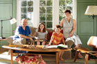 the Coyne family sits in their remodeled living room