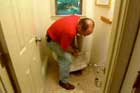 Richard Trethewey in the process of replacing an old toilet flange