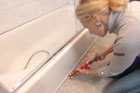 fixing a leak underneath a bath tub