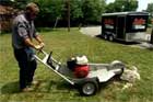 Roger Cook removes a tree stump