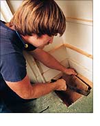 Cut hole for laundry chute.