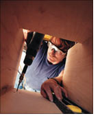 Screw the chase to the floor joists, use a level to make sure that the chute is plumb. 