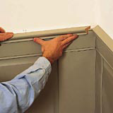 wainscoting step 11: fasten decorative cap rail to top