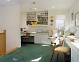 At the top of the stairs, the study gives the two kids lots of built-in working and storage space, as well as a corner window seat. 