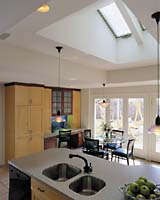 The new kitchen scores on three important points: increased natural light, ample room for an informal meal and a convenient link to the backyard.
