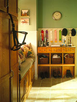 Standard kitchen cabinets can be imaginatively combined to suit your storage needs: A row of spice drawers from Merillat tops a bank of open cubbies.