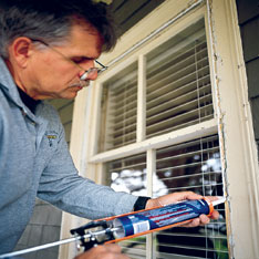 laying a bead of caulk on casing