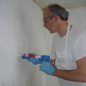 Waiting for the conditioner to soak in, squirting adhesive