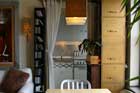 looking into kitchen of studio apartment