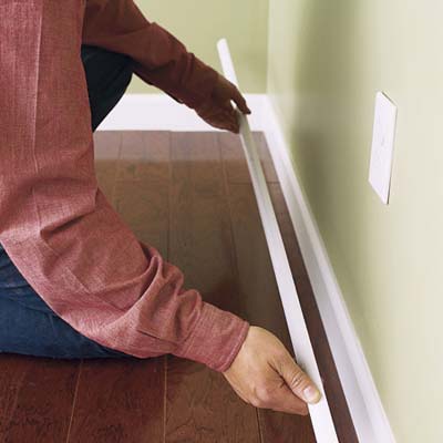 Attach molding to baseboards
